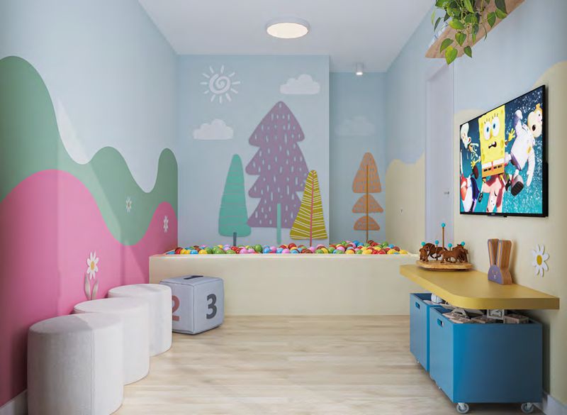 Brinquedoteca com piscina de bolinhas e pufes