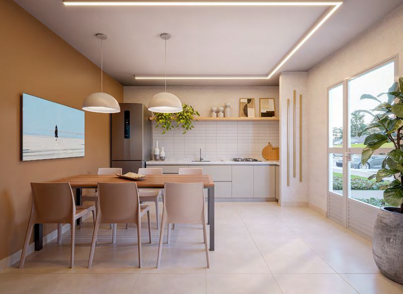 Espaço gourmet com bancada e mesa para refeições